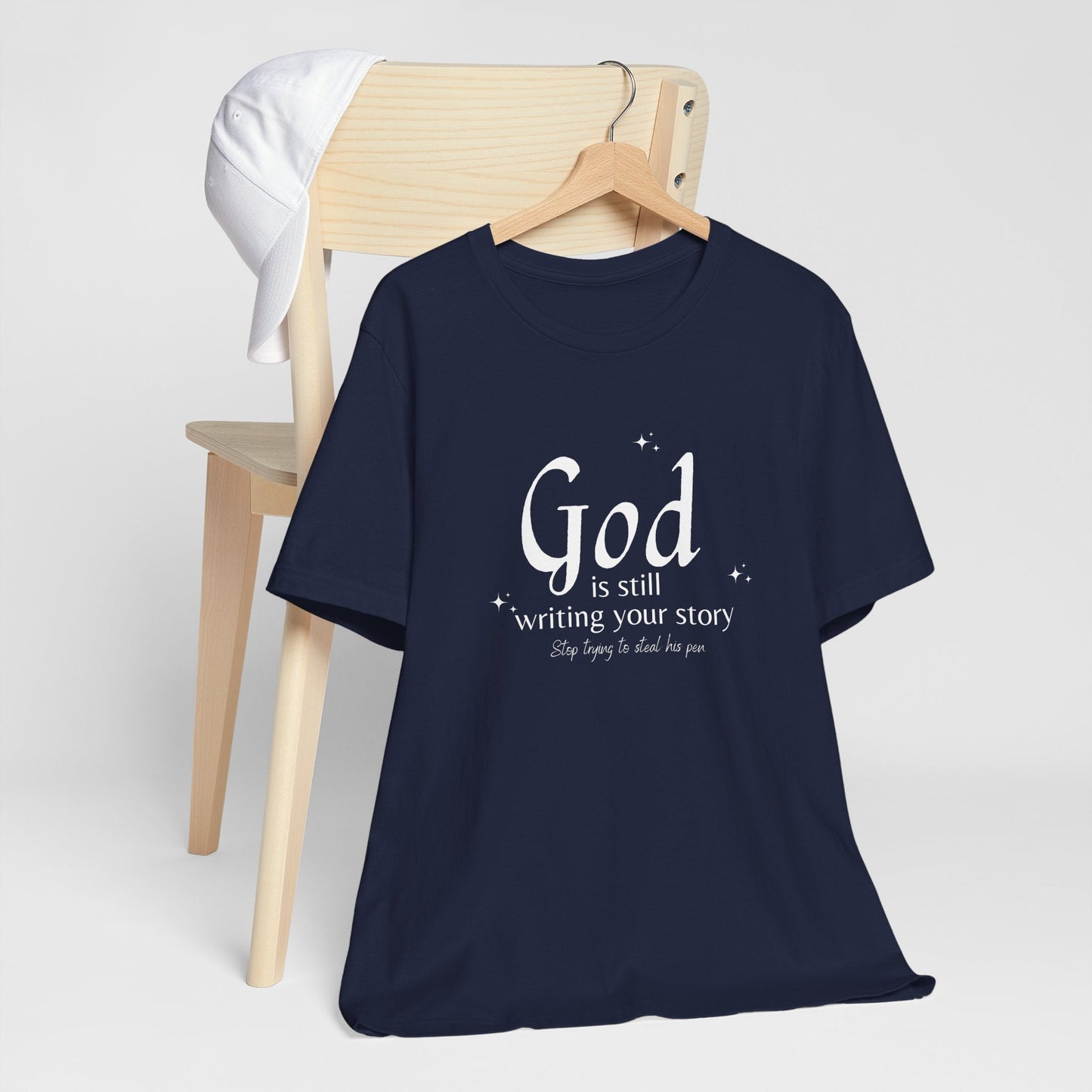 "God Is Still Writing | Unisex Jersey Short Sleeve Tee - RTS Gifts Emporium